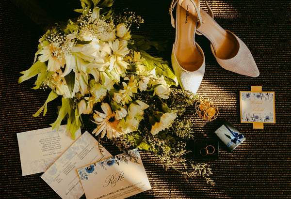 Traditional wedding Invitations with bridal shoes and wedding bouquet