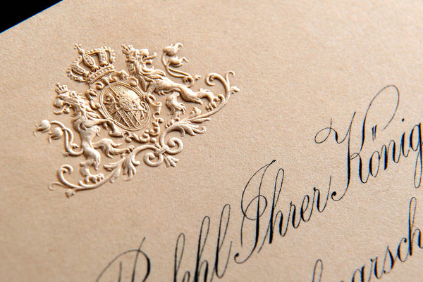  blind embossed crest on wedding invitations