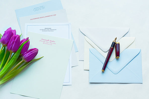 Personalised stationery showing writing paper in different pastel shades