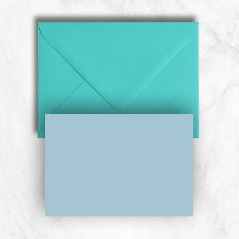 Plain lightly textured azure blue a6 cards teamed with turquoise envelopes