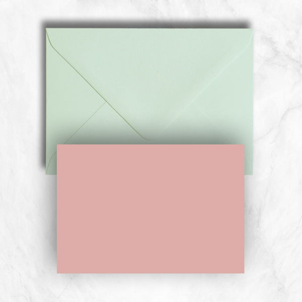 Plain lightly textured candy pink a6 cards teamed with pastel green envelopes