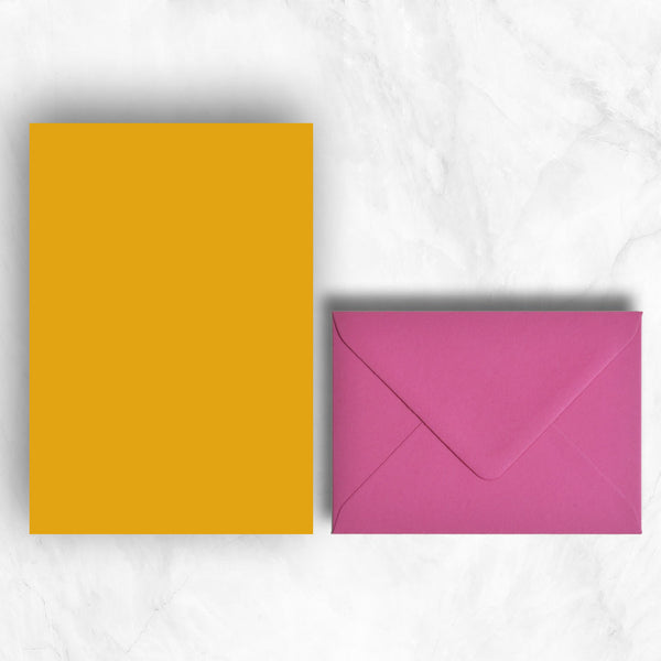 Plain lightly textured citrine yellow a5 sheets teamed with hot pink envelopes