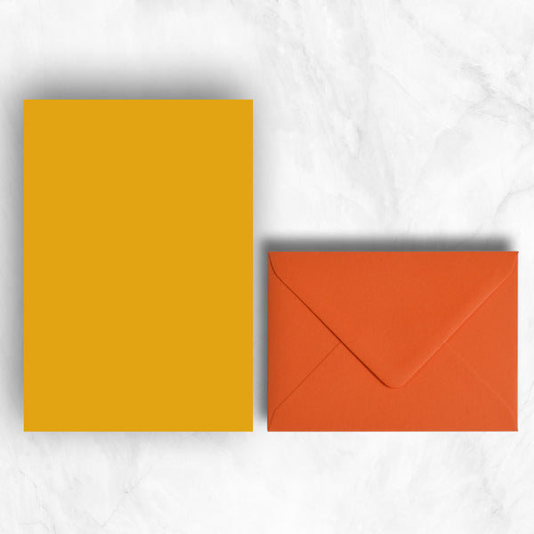 Plain lightly textured citrine yellow a5 sheets teamed with orange envelopes
