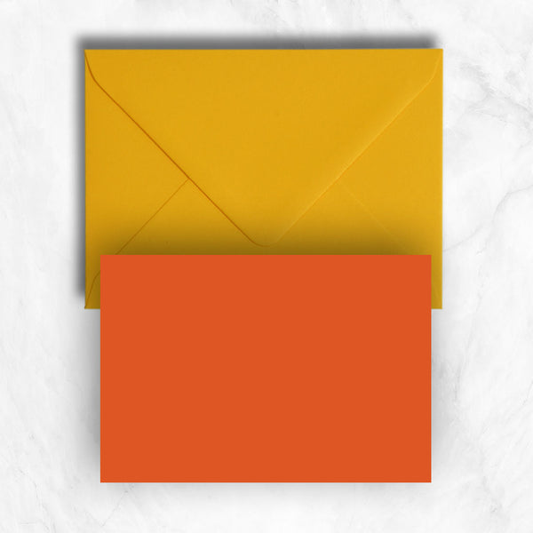 Plain lightly textured orange a6 cards teamed with citrine yellow envelopes