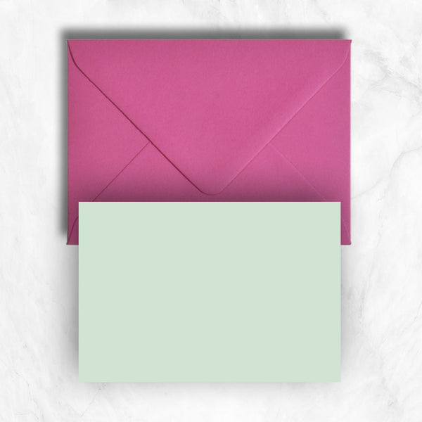 Plain lightly textured pastel powder green a6 cards teamed with hot pink envelopes