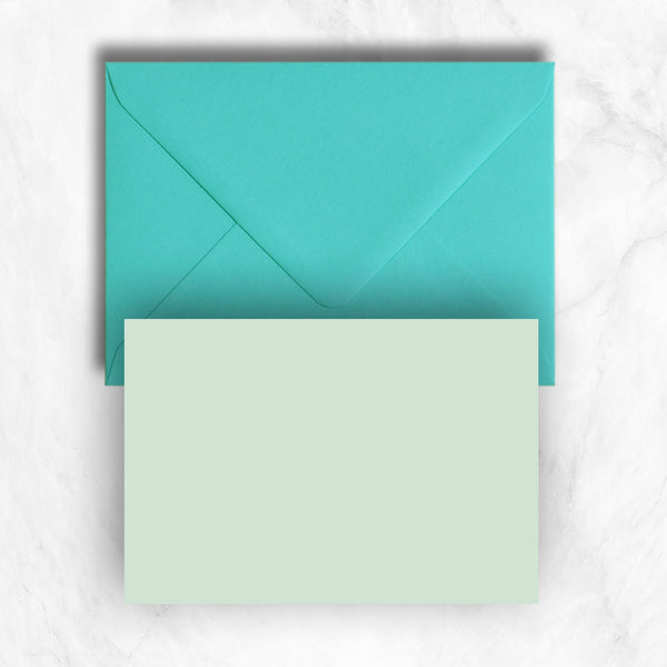 Plain lightly textured pastel powder green a6 cards teamed with turquoise envelopes