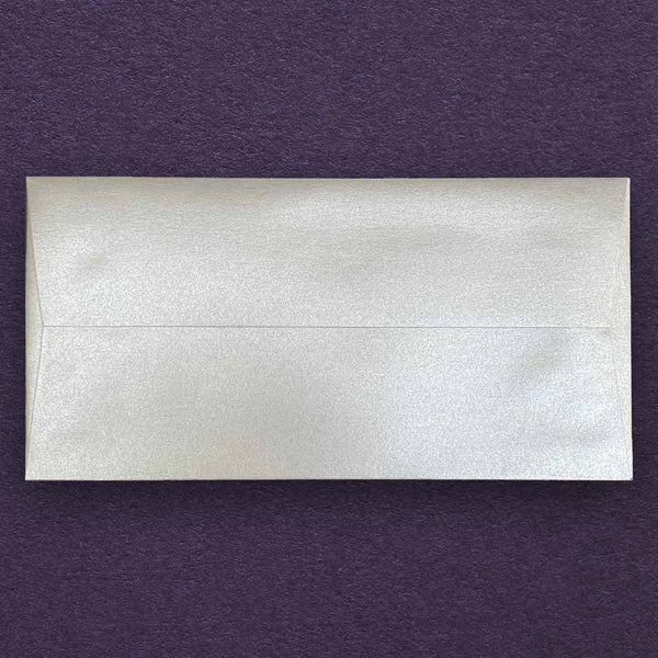 shimmering silver peel and seal dl envelopes made using peregrina pearlescent paper and have a straight flap