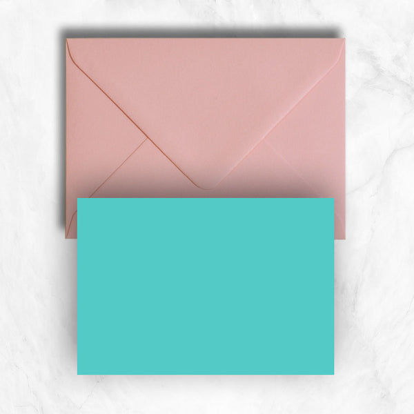Plain lightly textured turquoise a6 cards teamed with pastel candy pink envelopes
