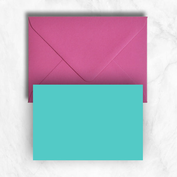 Plain lightly textured turquoise a6 cards teamed with hot pink envelopes