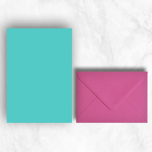 Plain lightly textured turquoise a5 sheets teamed with hot pink envelopes