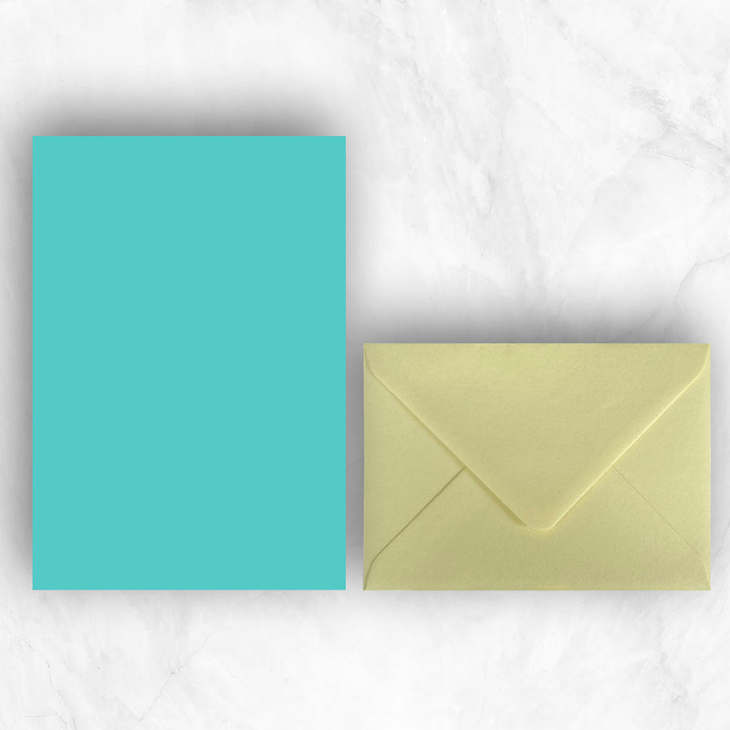 Plain lightly textured turquoise a5 sheets teamed with yellow envelopes