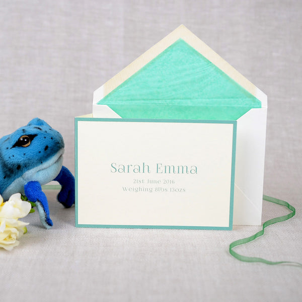 The folded Abersoch birth announcement cards and envelope with aqua tissue paper lining