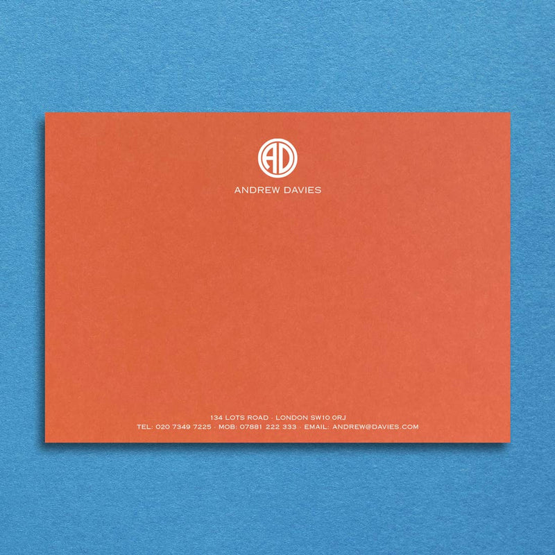 Our mandarin orange card provides a glorious contrast for a contemporary monogram printed in white at the head with your contact details at the foot.