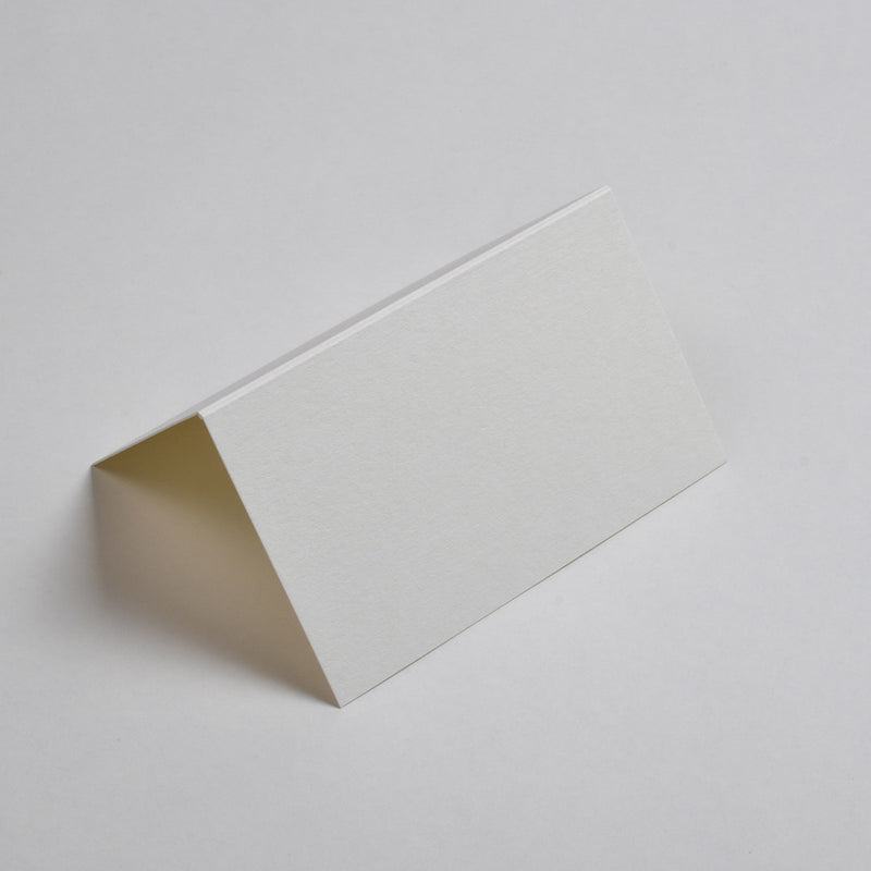 The cream place cards are tent folded and smooth to the touch