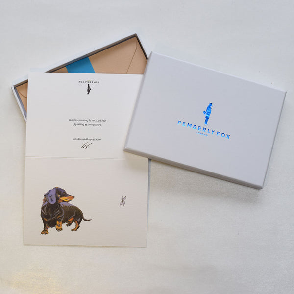 the Dachshund dog greeting cards shown here with the accreditation to designer susie macinnes on the back
