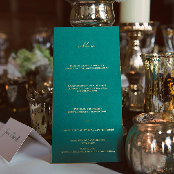 The beautiful elvetham wedding menu cards with gold foil and matching gold edges on emerald green card.