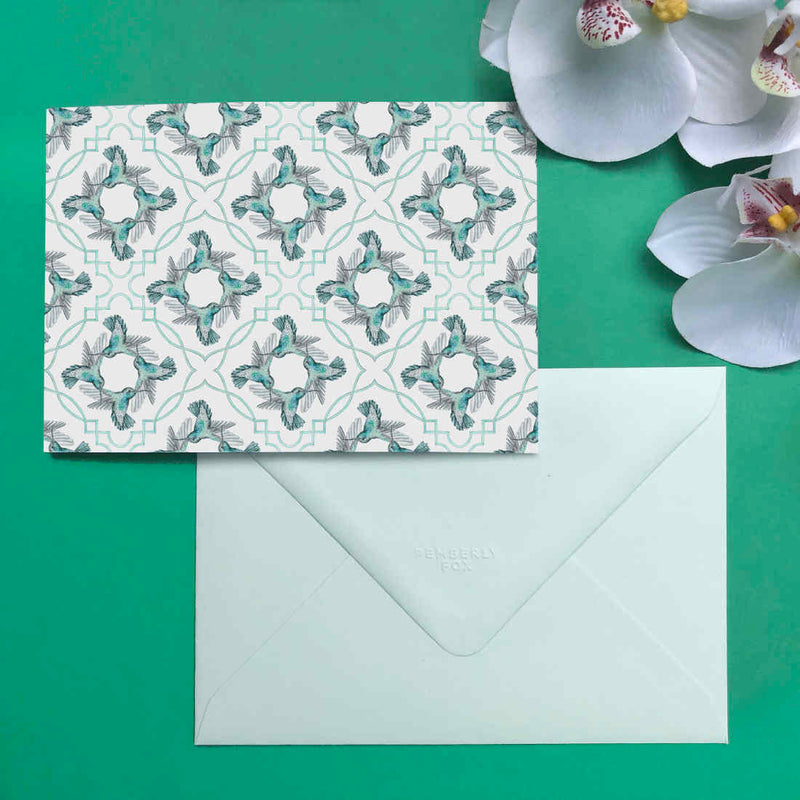 The green hummingbird card, face down showing the diamond flapped matching light green envelope