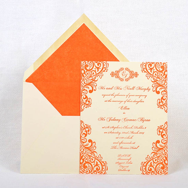 The Parnell letterpress wedding invitation is shown here on a cream card with matching white tissue paper lined envelopes