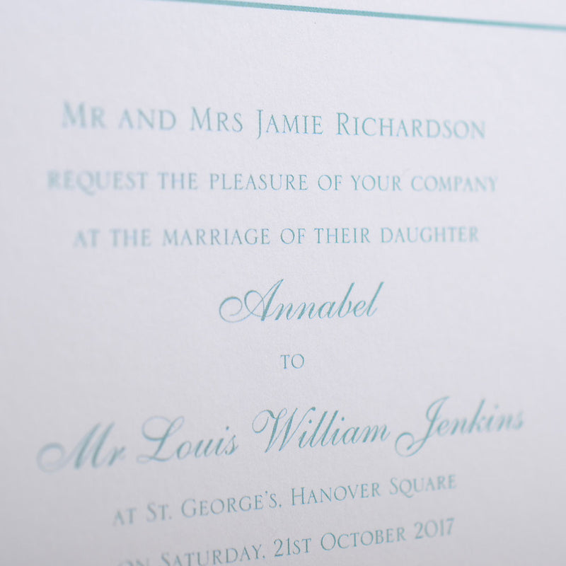 a close up of the Savile wedding invitation wording, printed in aqua onto white card