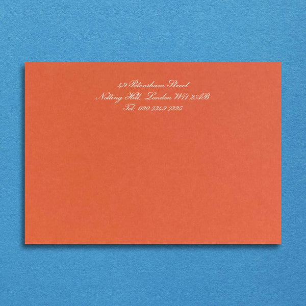 Printed in white onto a mandarin orange card with your details centred at the head of the card