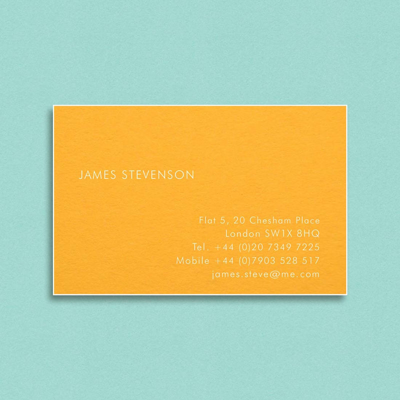 The Vale visiting cards show white ink engraved onto a citrine card which is finished with white edges