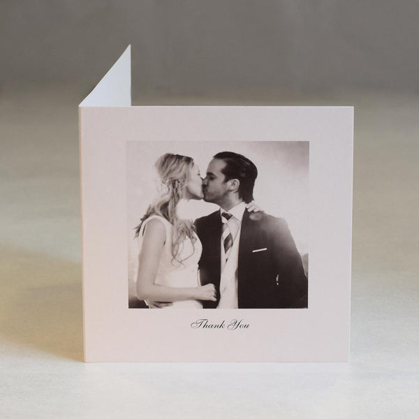 This square formatted card shows a photo with a large white border and a small message printed under the photo