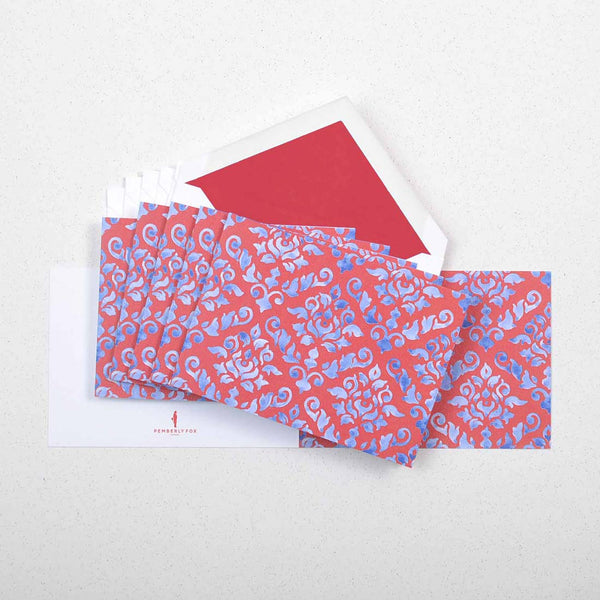 the blue and red damask pattern greeting cards shown fanned out with matching tissue paper lined envelopes