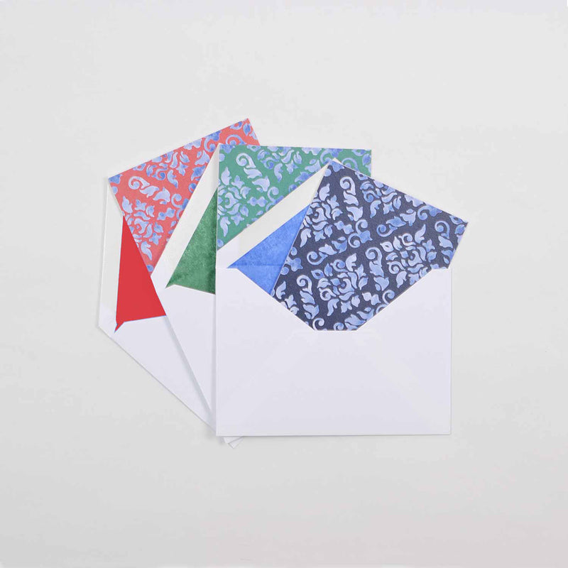 the dark shades of damask pattern greeting card shown in their white envelopes which are lined with matching tissue paper