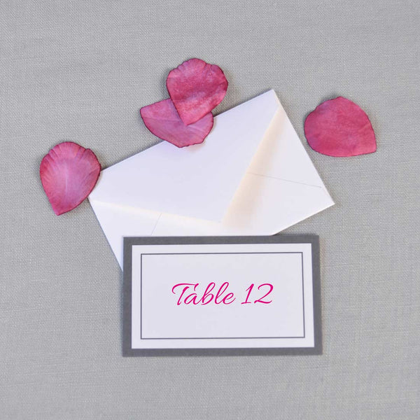 The Farringdon wedding escort cards are personalised with your guest's name in shocking Pink on one side with grey borders