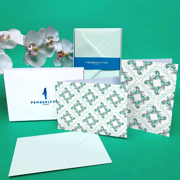 The green hummingbird greeting cards are folded, blank on the inside and come with matching green envelopes