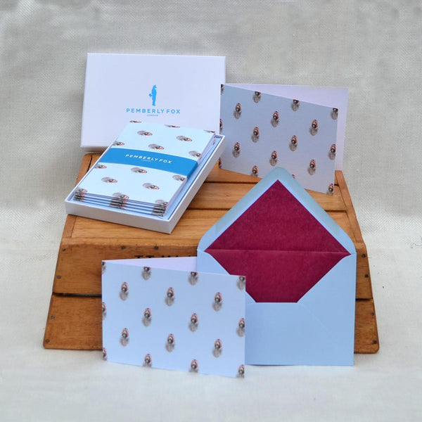 the pheasant feather greeting cards with their blue envelopes lined with purple tissue paper lining, sold in pemberly fox boxes