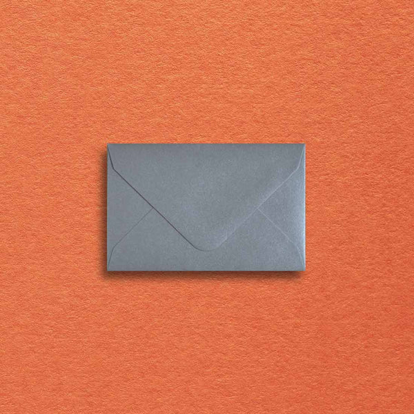 a pearlescent silver paper is used to make these mini envelopes with a diamond flap
