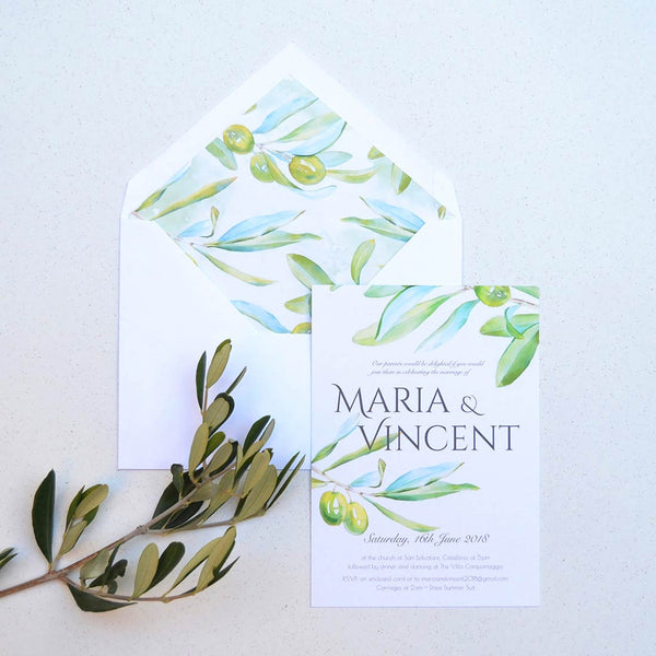 The Tivoli wedding invitation shows your text framed by olives and comes with lined envelopes