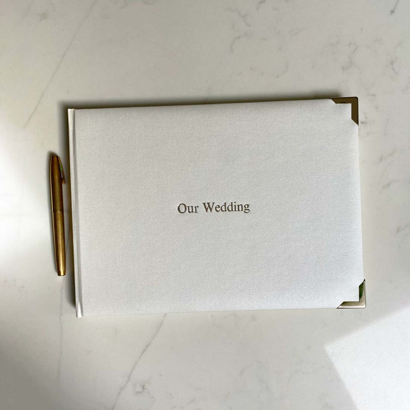 Our Beautiful Wedding Guest Books, made using a faux leather cover with protective chrome corners