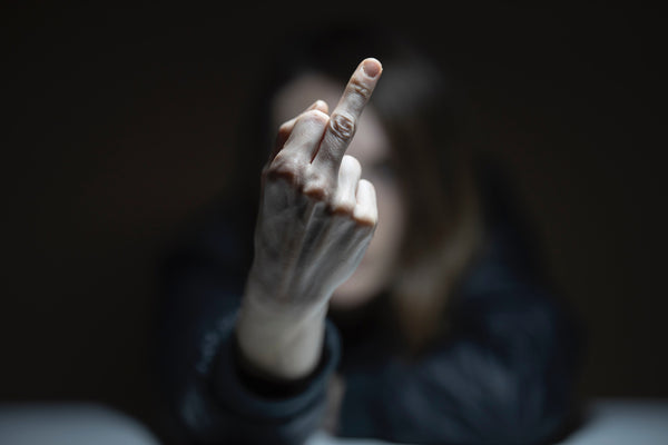 picture of a woman showing the middle finger
