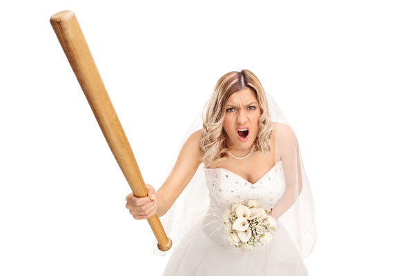 A picture of an angry bride holding a club and screaming