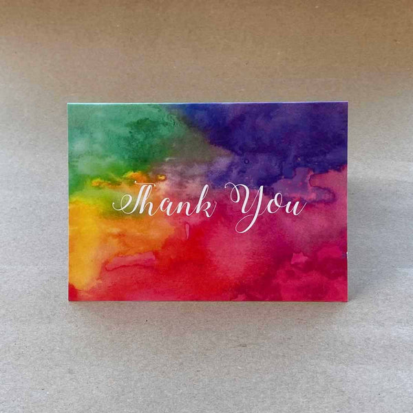 Folded cards with a bold coloured wash on the front cover with English language 'thank you'. Sold in packs of 6 with matching white envelopes.