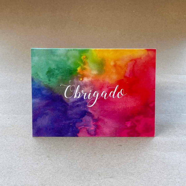 Folded cards with a bold coloured wash on the front cover with portuguese language 'thank you'. Sold in packs of 6 with matching white envelopes.