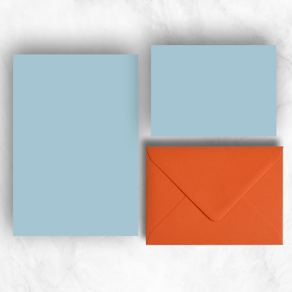 Plain lightly textured azure blue a6 cards and a5 writing sheets teamed with orange envelopes