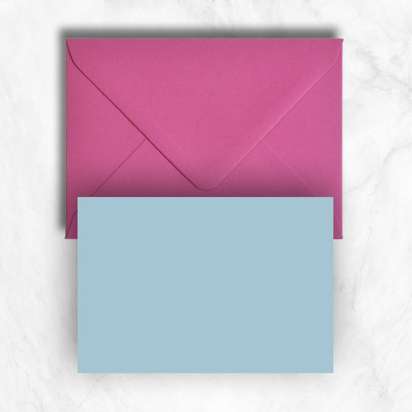 Plain lightly textured azure blue a6 cards teamed with hot pink envelopes