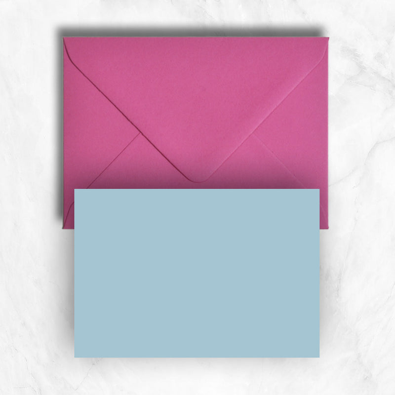 Plain lightly textured azure blue a6 cards teamed with hot pink envelopes