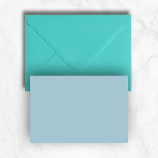 Plain lightly textured azure blue a6 cards teamed with turquoise envelopes