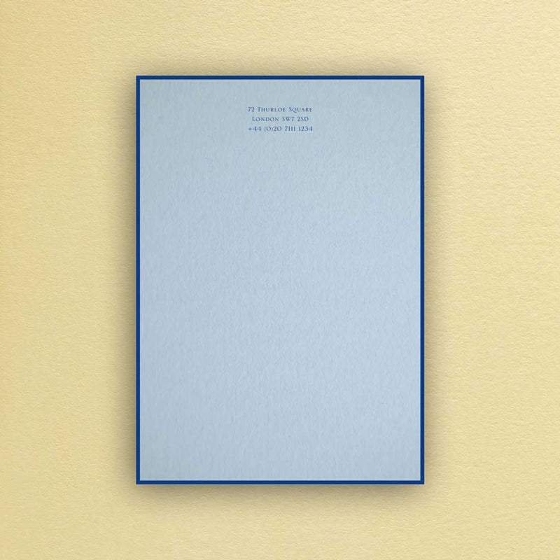 The Bond writing paper shows your personalised text printed in dark blue onto a light blue sheet with a matching border.