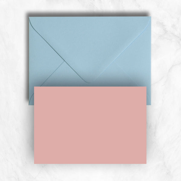Plain lightly textured candy pink a6 cards teamed with pastel blue envelopes
