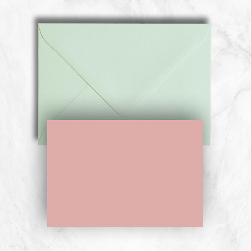 Plain lightly textured candy pink a6 cards teamed with pastel green envelopes