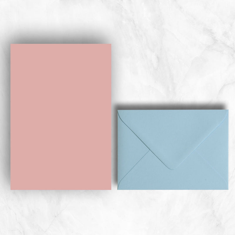 Plain lightly textured candy pink a5 sheets teamed with pastel blue envelopes