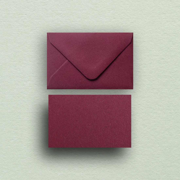 Our deep burgundy wedding escort cards and envelopes are made from textured colorplan claret  card and paper
