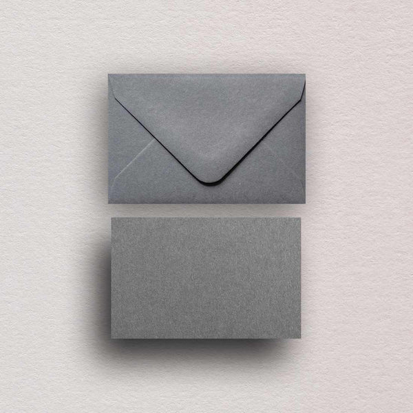 Our dark grey escort cards and envelopes are made from textured Colorplan smoke grey and paper