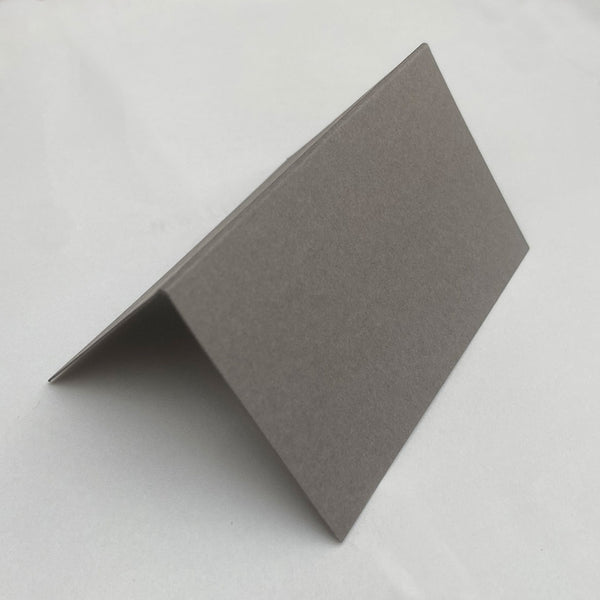 Made from an elegant grey 350gsm card, these folded place cards are sold in packs of 20