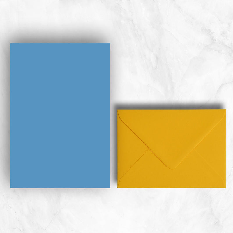Plain lightly textured new blue a5 sheets teamed with citrine yellow envelopes